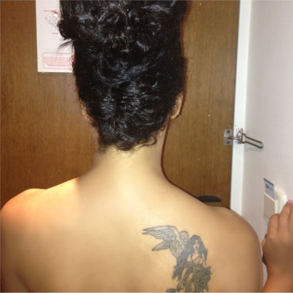 Nadia Buhari goes topless to show off tattoo