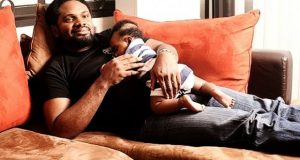 Cobhams Asuquo and his baby