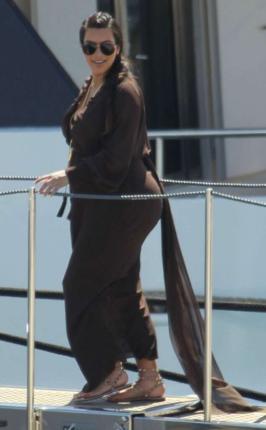 Kim Kardashian Shows Off Growing Bump In Greece