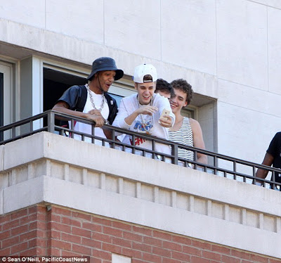 Justin Bieber spits on his fans from his hotel