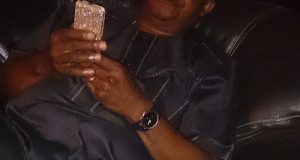 Tonto Dikeh's dad poses with her diamond plated iPhone