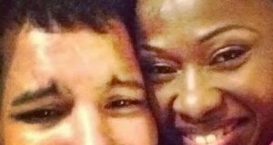 Uche Jombo and her husband cuddling