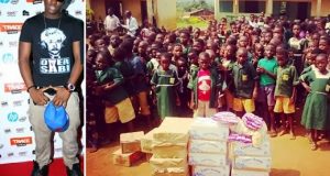 Dammy Krane donates Capri sonne and Lollipop to school children