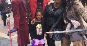 Annie, Isabella & Charles Idibia strikes a pose with Jack Sparrow