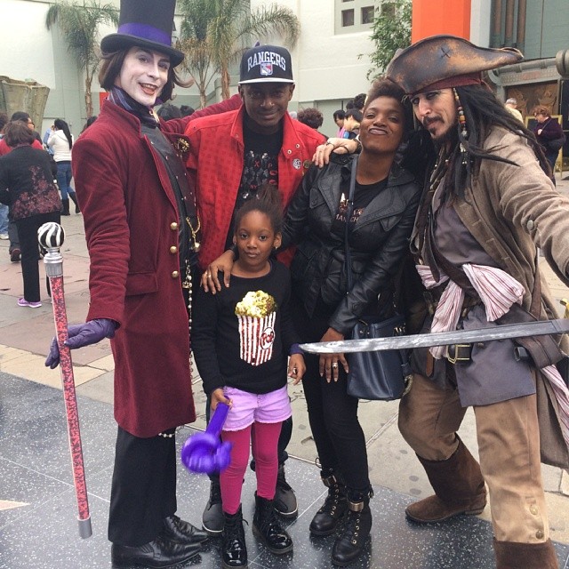 Annie, Isabella & Charles Idibia strikes a pose with Jack Sparrow