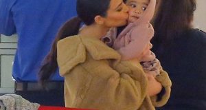 Kim K kisses and North West