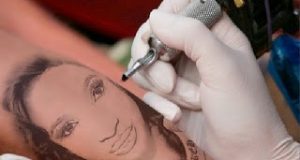 Super fan tattoos Tonto Dikeh's face on her arm
