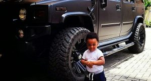 Andre poses with Uncle Jude’s new hummer beast