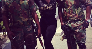 Annie Idibia poses with hunky men of the Nigerian army