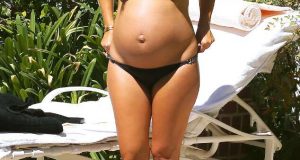 Kourtney Kardashian shows off baby bump in bikini