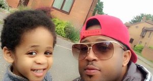 Mike Ezuruonye with son