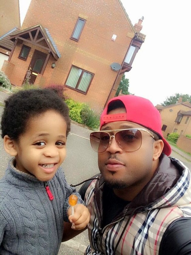 Mike Ezuruonye with son