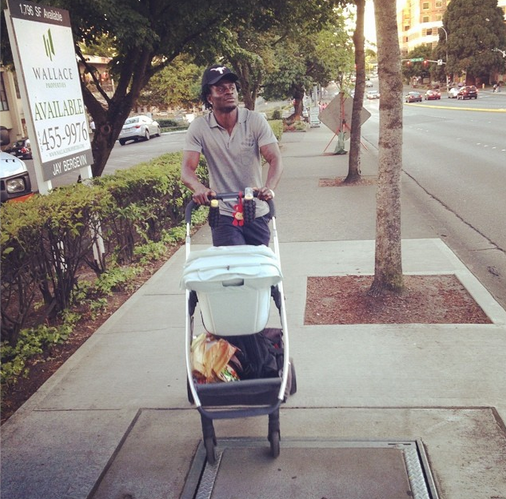 Obafemi Martins goes strolling with his son