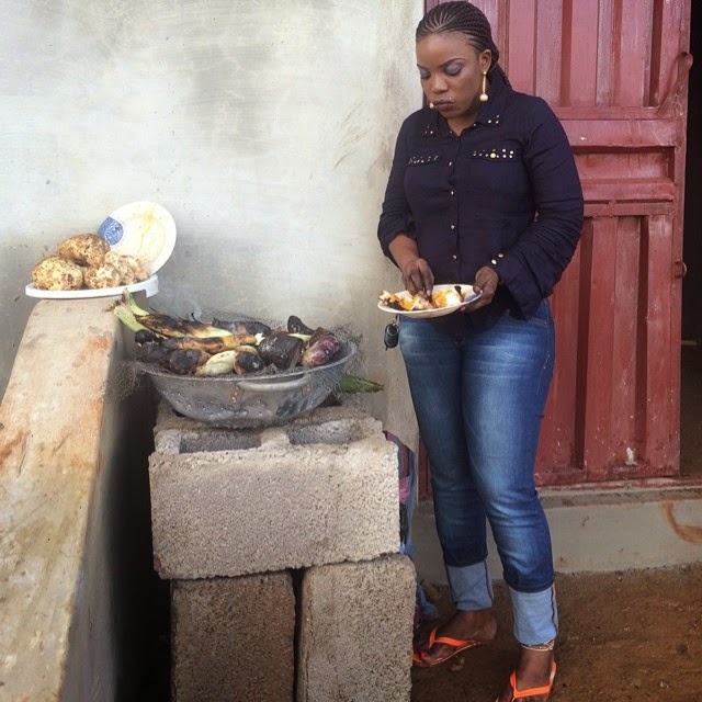 Empress Njama eating roasted yam