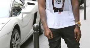Kanye West wears a shirt of Kanye West wearing a shirt of Kanye West