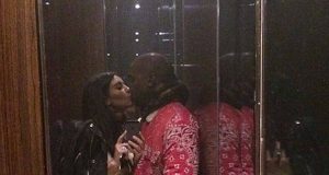 Kim Kardashian and Kanye West kissing in an elevator