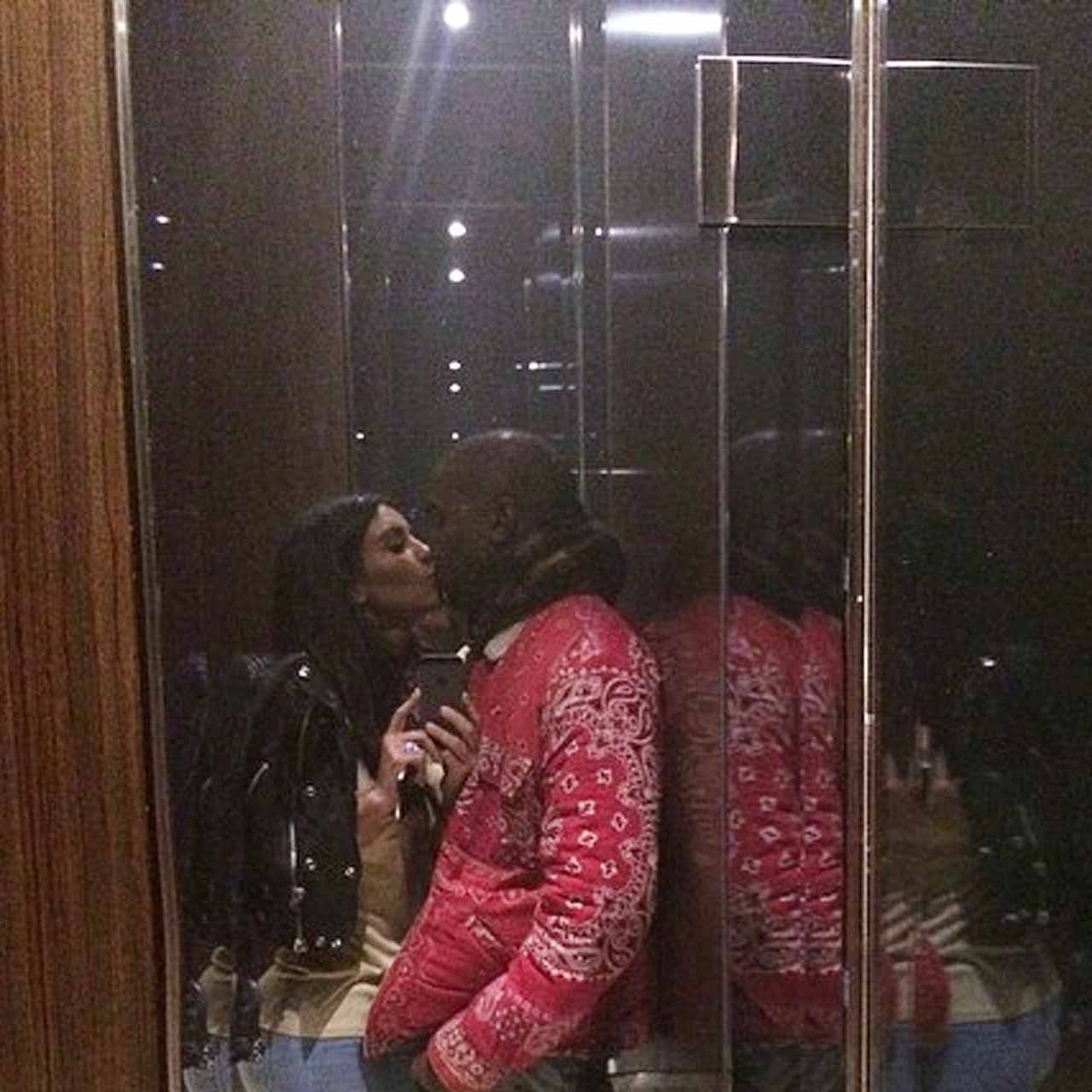 Kim Kardashian and Kanye West kissing in an elevator