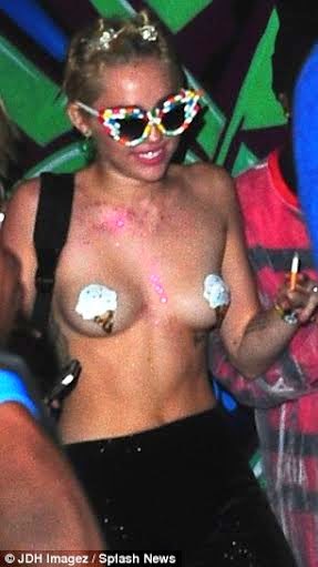 Miley Cyrus parties topless 2014 NaijaVibe