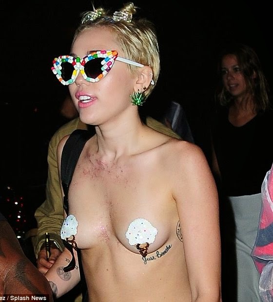 Miley Cyrus parties topless NaijaVibe 2014