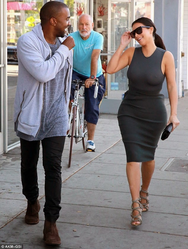 Kim K steps out in bra less top as Kanye West stares on