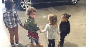 North West Holds hands with her cousins