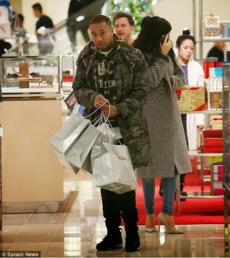 Tyga carries Kylie's Christmas shopping bags