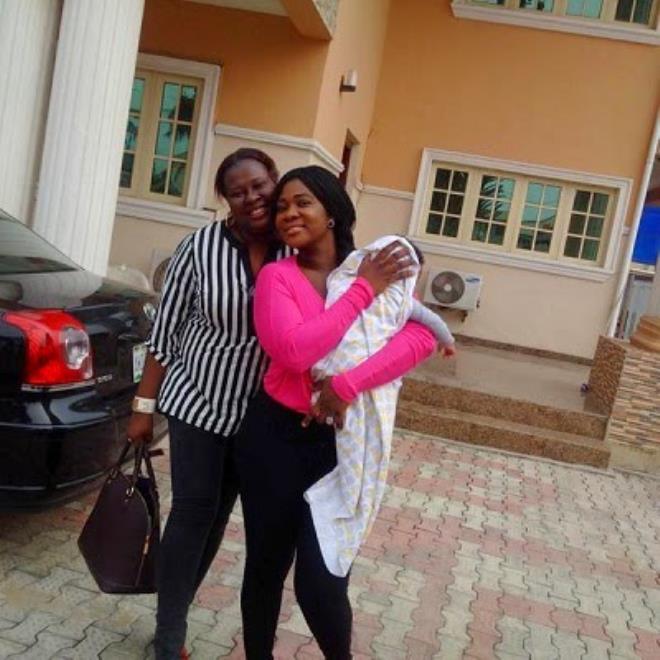 Mercy Johnson and her son as she returns to Nigeria