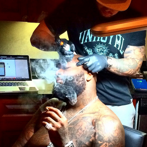 Rick Ross getting face tattoo
