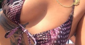 Rihanna shows off her cleavage in bikini photo