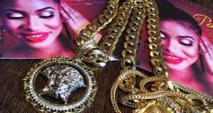 Tonto Dikeh flaunts her boo's diamond encrusted Jesus piece necklace