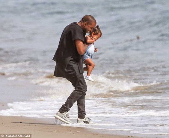 Kanye West and his daughter