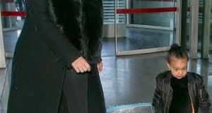 North West carry her own suitcase