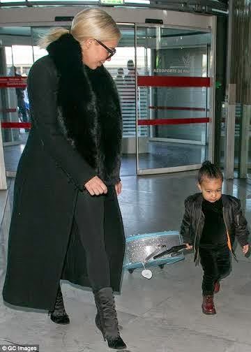 North West carry her own suitcase
