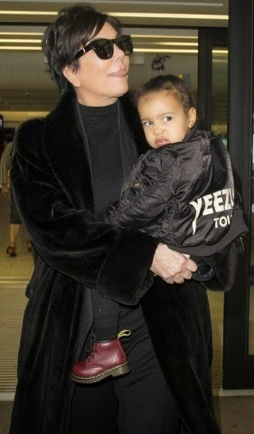 North West frowns at paparazzi