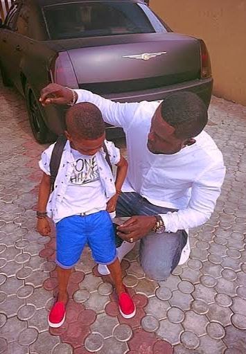 Yomi Casual with his son