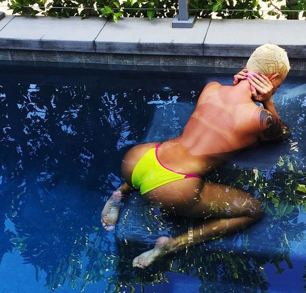 Amber Rose goes topless