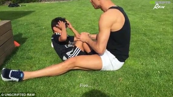 Cristiano Ronaldo sit-ups with his son
