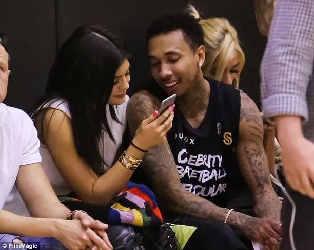 Kylie Jenner & Tyga loved up at basketball game