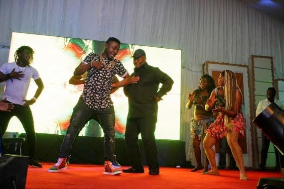 MC Galaxy performing with Governor Godswill Akpabio