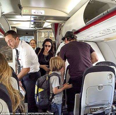 Angelina Jolie & Brad Pitt cause a stir as they fly Economy