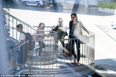 Angelina Jolie and Brad Pitt cause a stir as they fly Economy with their 6 kids