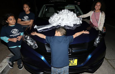 Chris Brown gifts family with a car