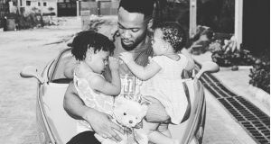 Flavour pictured with his two daughters