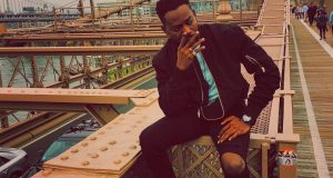 Adekunle Gold Takes Dapper Photo At Brooklyn Bridge