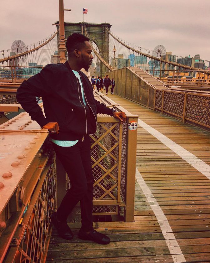 Adekunle Gold Takes Dapper Photos At Brooklyn Bridge