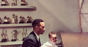 John Legend and Luna playing the piano