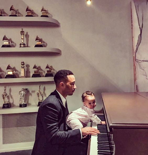 John Legend and Luna playing the piano