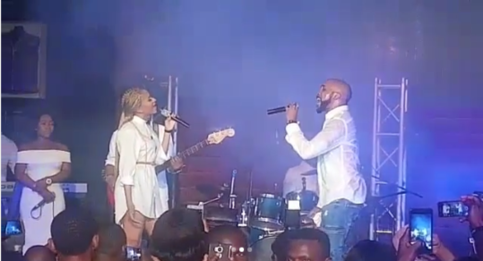 Banky W and Adesua Etomi sing together on stage at HardRock Cafe