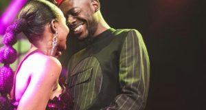 Adekunle Gold gives Simi a kiss after his concert