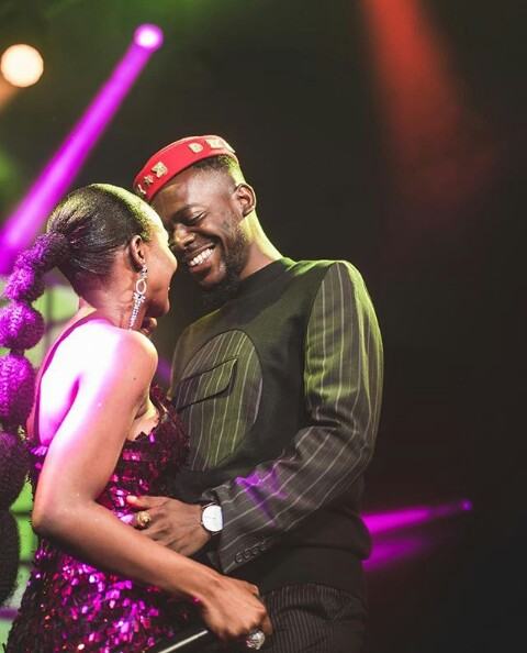 Adekunle Gold gives Simi a kiss after his concert